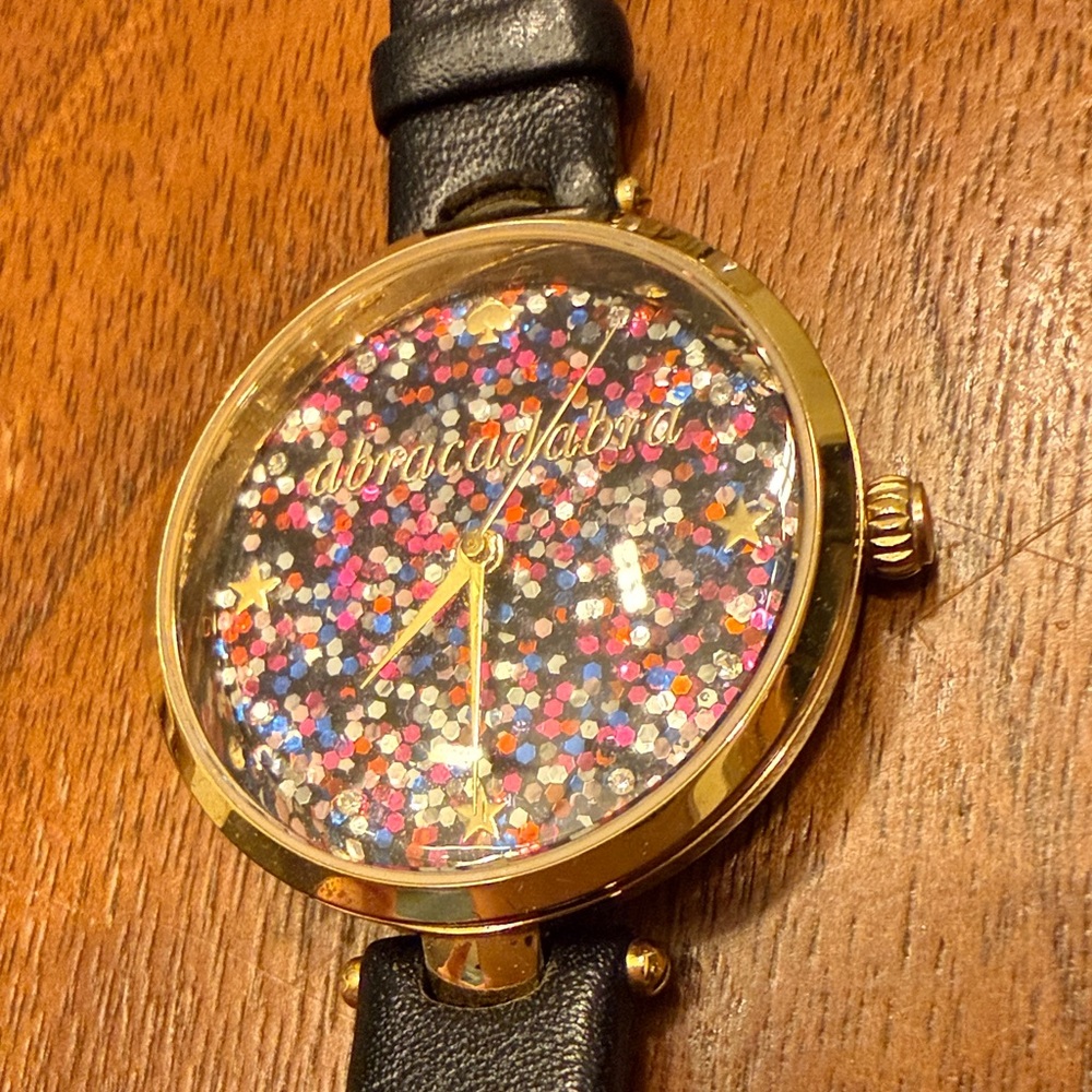 Kate Spade Gold and Black “abracadabra” Glitter Watch